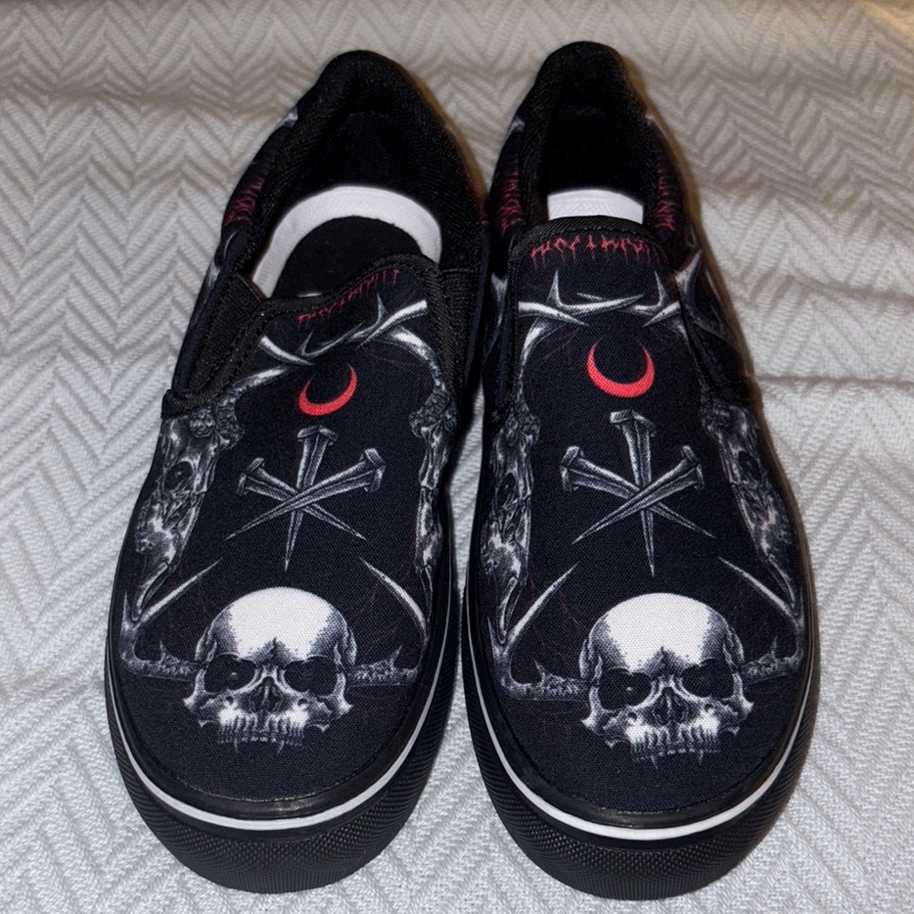 Black Slip-On Shoes with Skull Design